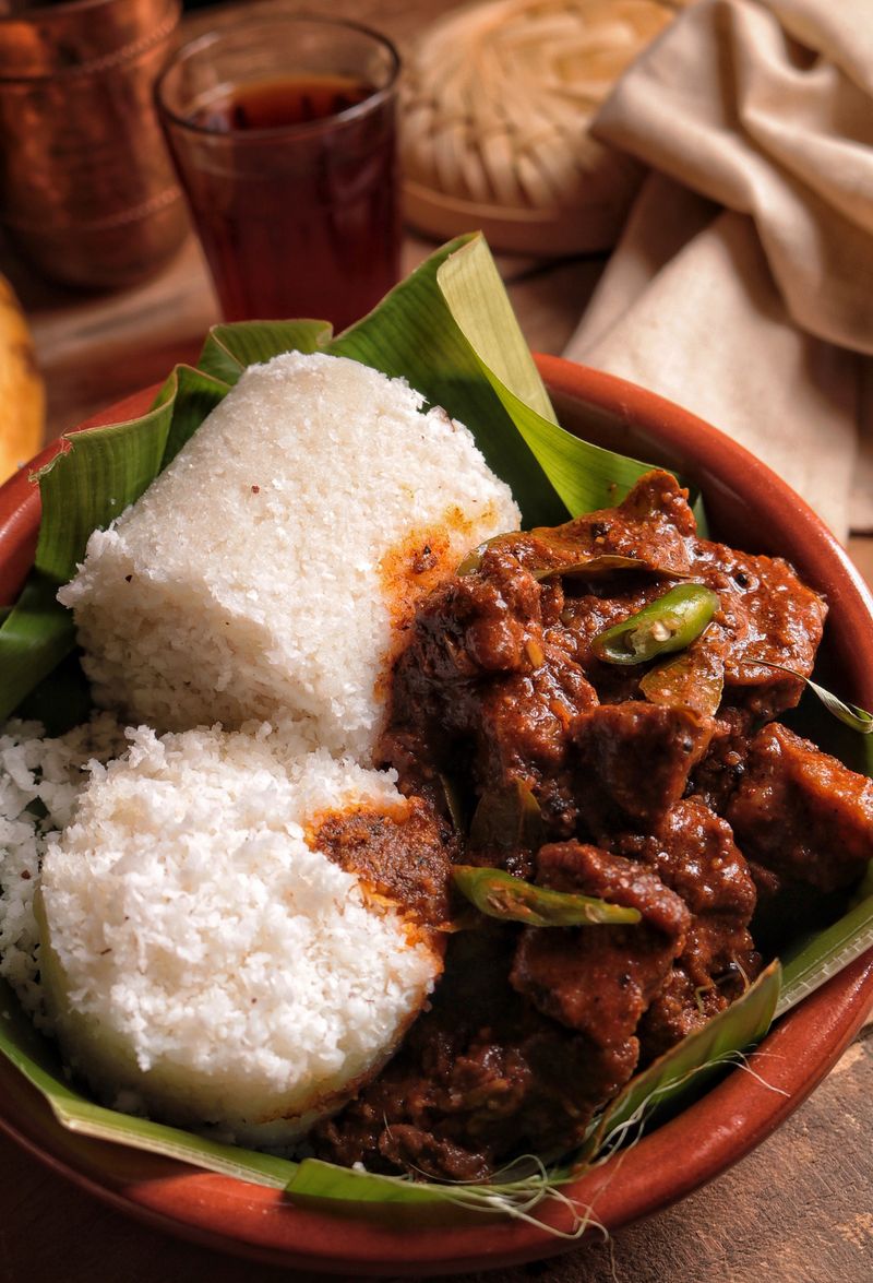 Kerala beef fry with puttu on a banana leaf