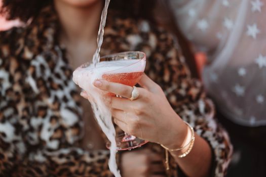 Woman Holding Clear Drinking Glass With Red Liquid