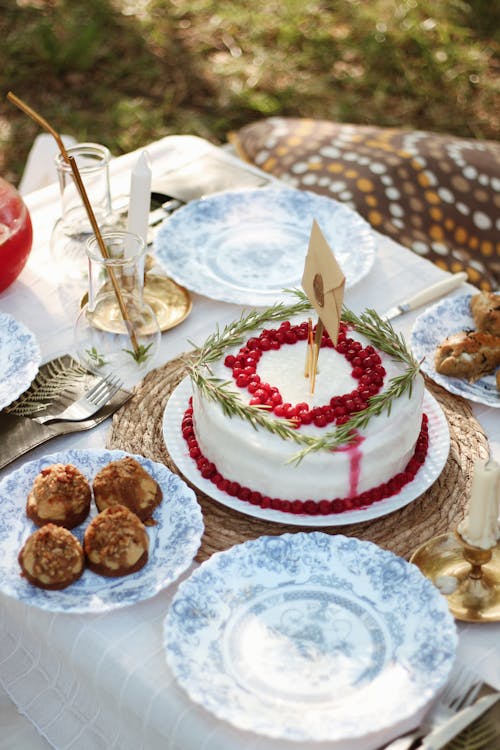 White and Red Cake on Table