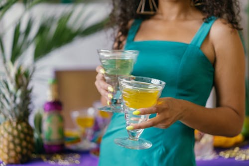 Woman Holding Cocktail Glasses