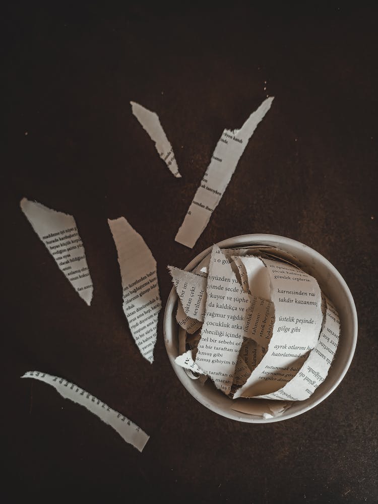 Overhead Shot Of Shredded Papers In A Bowl