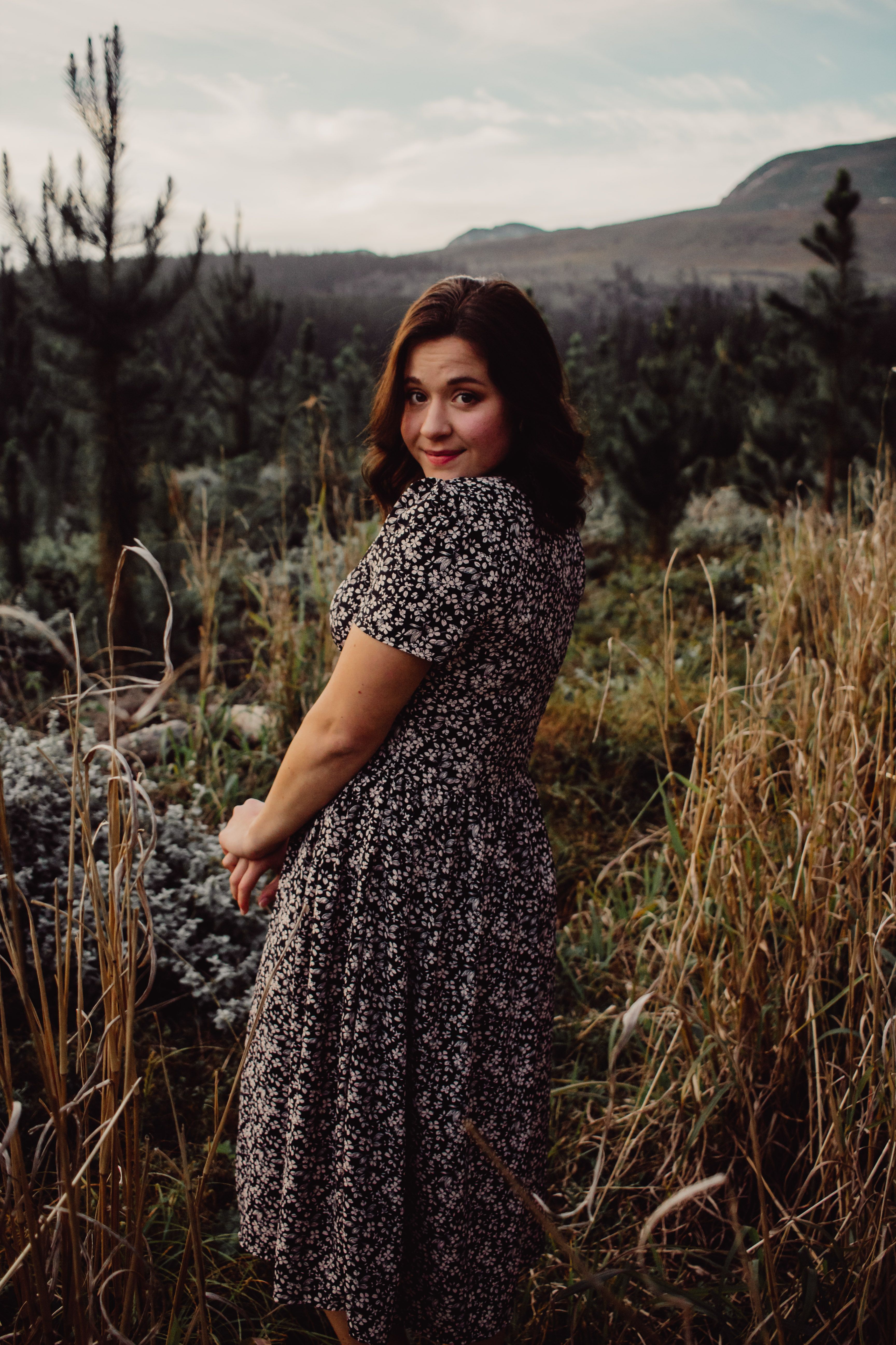 Woman in a Floral Dress Sitting on the Grass · Free Stock Photo