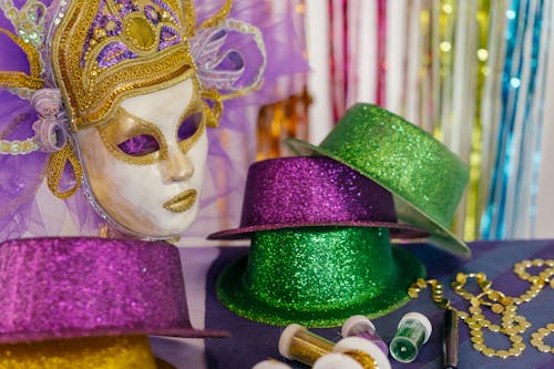 Close-up of a Mask and Glittery Hats