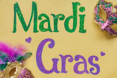 Free Colorful Masks and a Mardi Gras Poster Stock Photo
