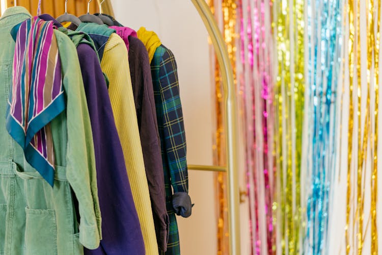 Assorted Coats Hanging In A Clothes Rack