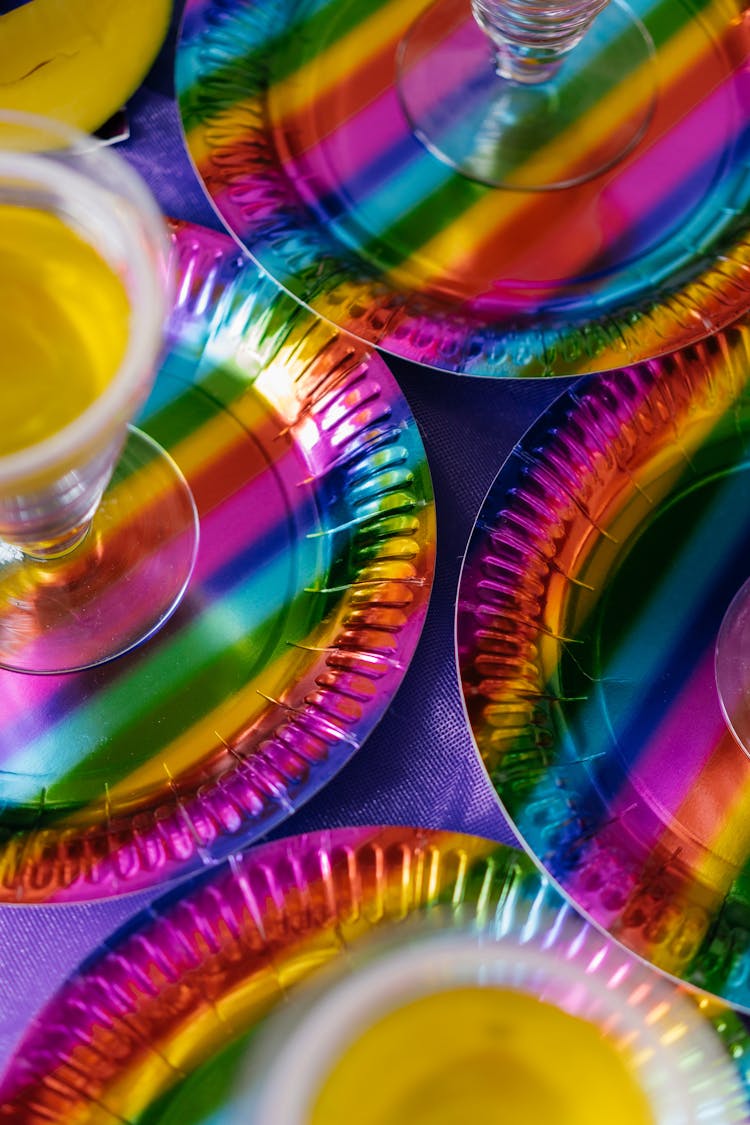 Overhead Shot Of Colorful Plates With Drinks