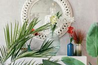 Flower Vases in Front of a Wall Mirror