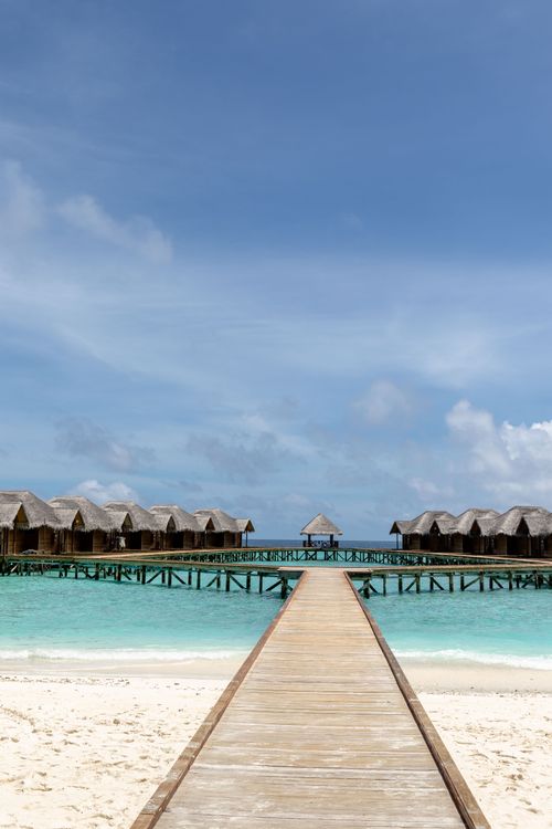 Free Idyllic view of overwater bungalows in the Maldives, perfect for travel and relaxation. Stock Photo