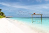 White and Green Wooden Beach Cottage on Beach