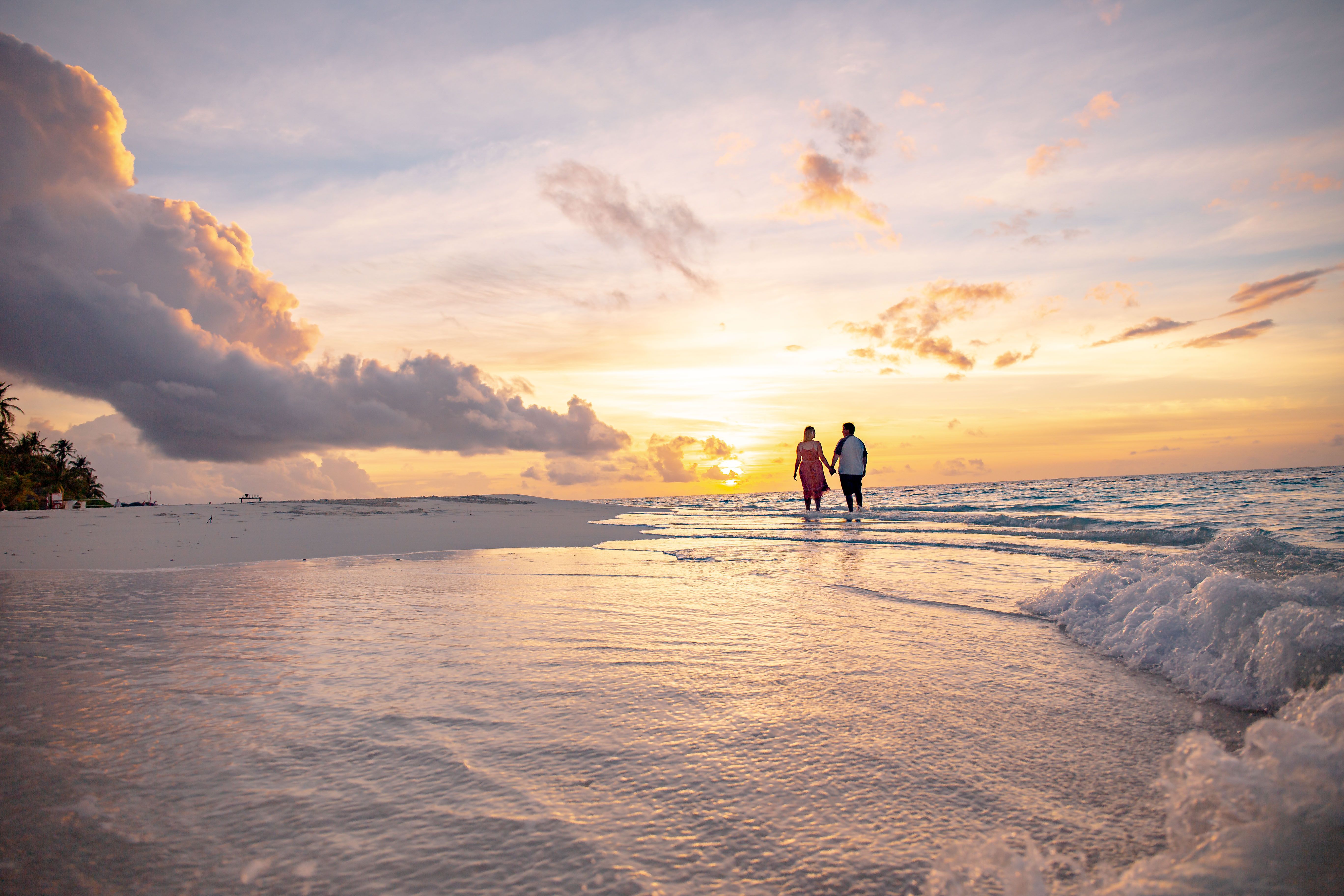 man and Woman Walking on the Beach · Free Stock Photo