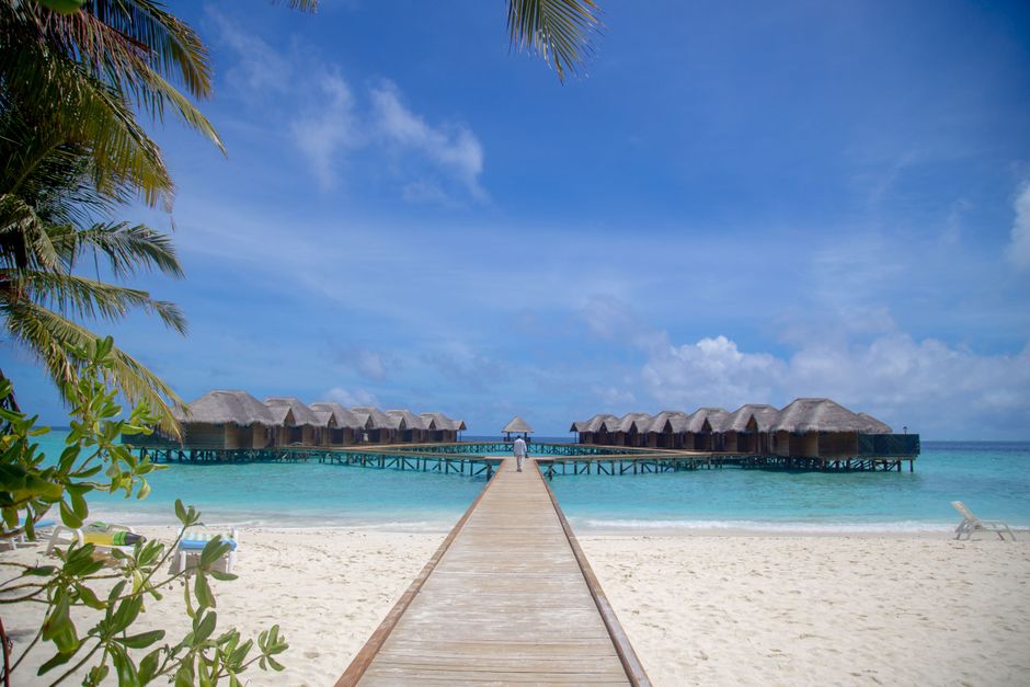 Luxury resort in the Maldives with a brief, light tropical rain shower
