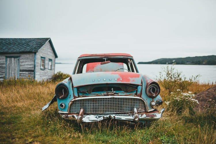 Abandoned Car Near A House