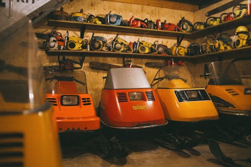 Snowmobiles Parked on a Garage