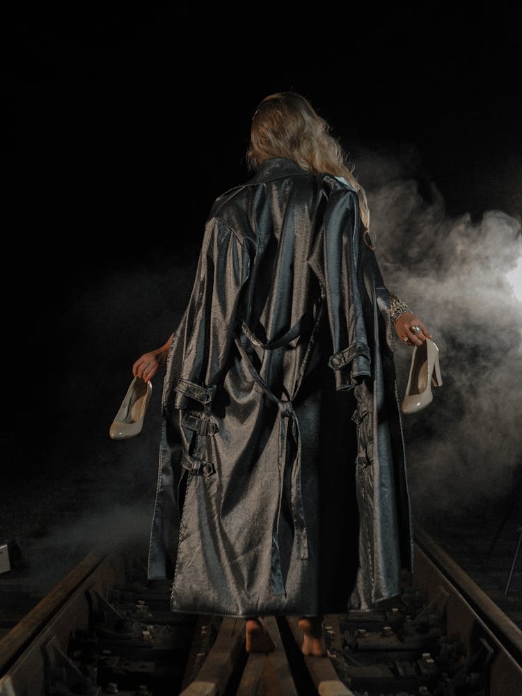 Barefoot Woman Walking On Tracks At Night