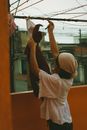 Woman Hanging Clothes on a Clothesline