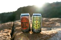 Two Brown and Black Labeled Can on Brown Rock