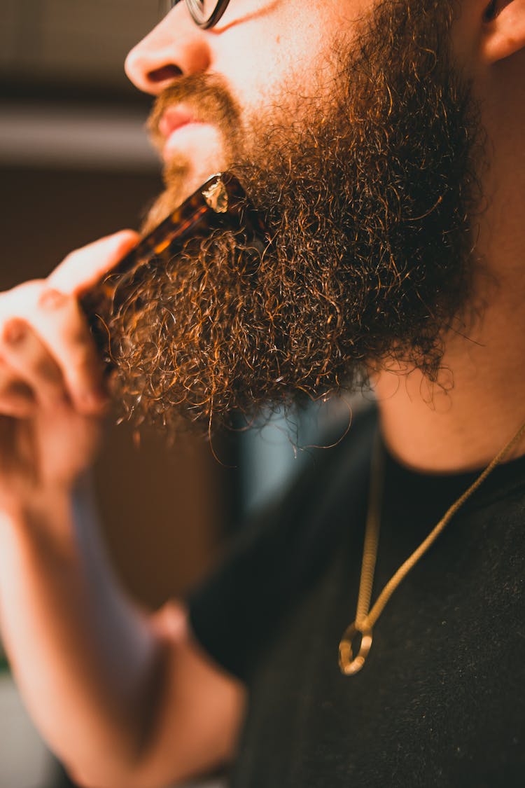 Man Combing His Beard