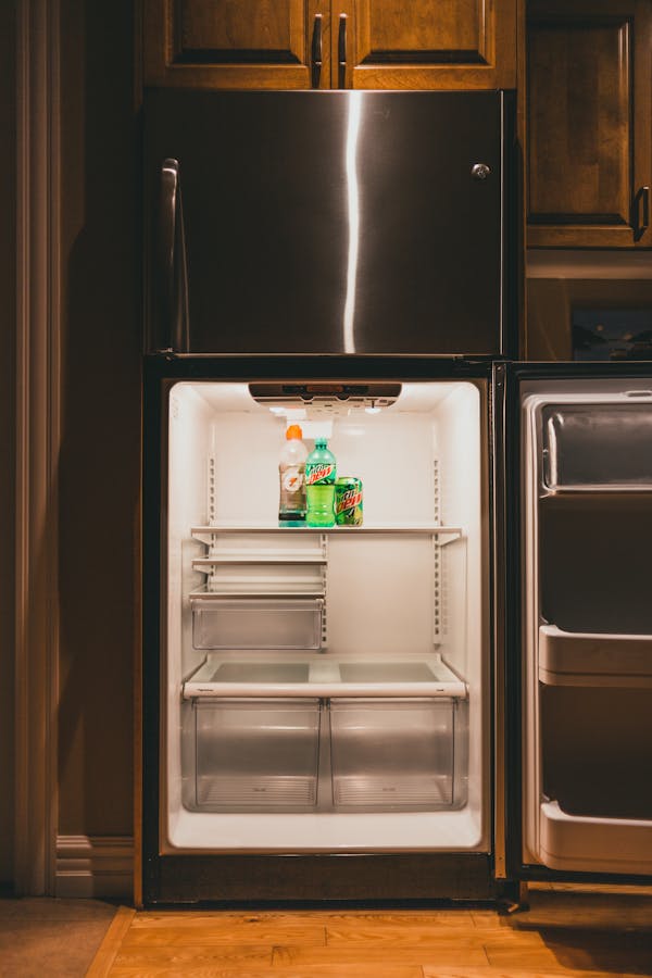 Mountain Dew and Gatorade Inside an Empty Refrigerator