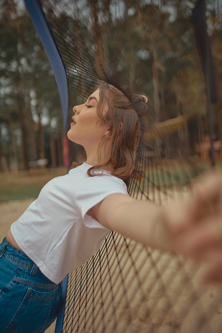 Girl Posing Near Net Outdoors