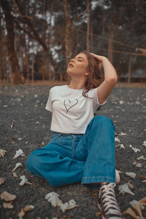 Shallow Focus of a Woman Sitting on the Grass