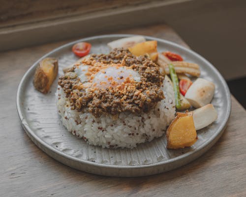 Rice With Fried Egg Toppings on a Plate
