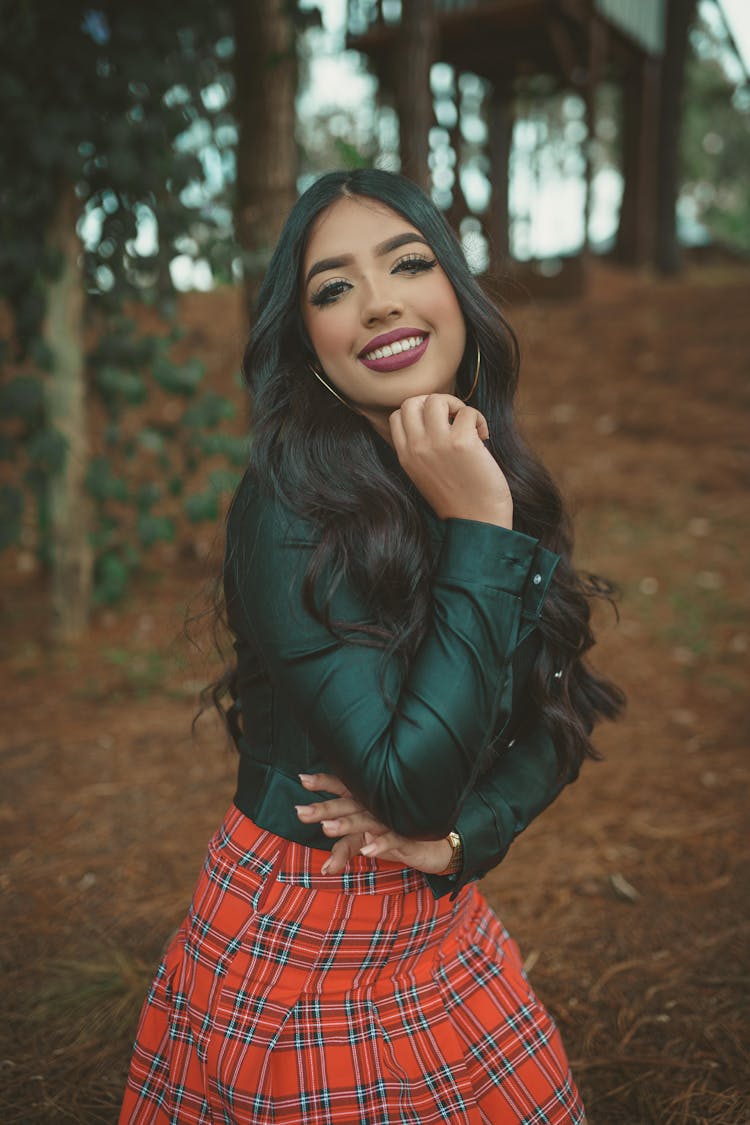 Woman In Black Leather Jacket And Red Plaid Skirt