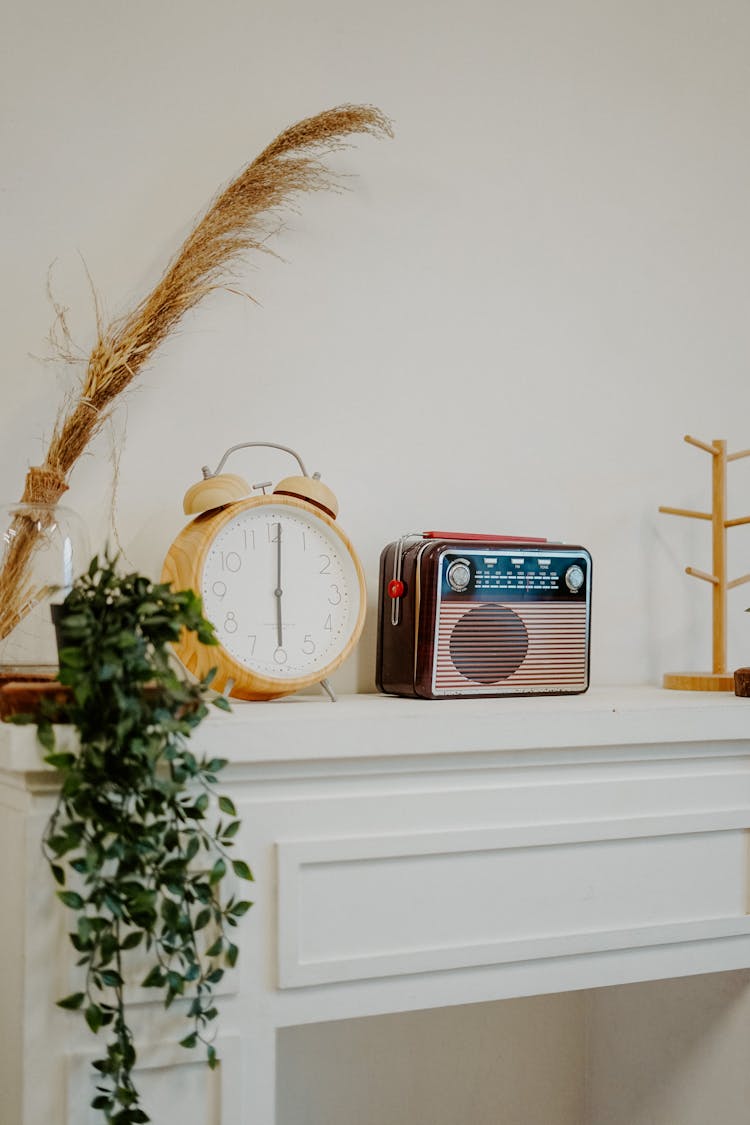 Radio Beside An Alarm Clock