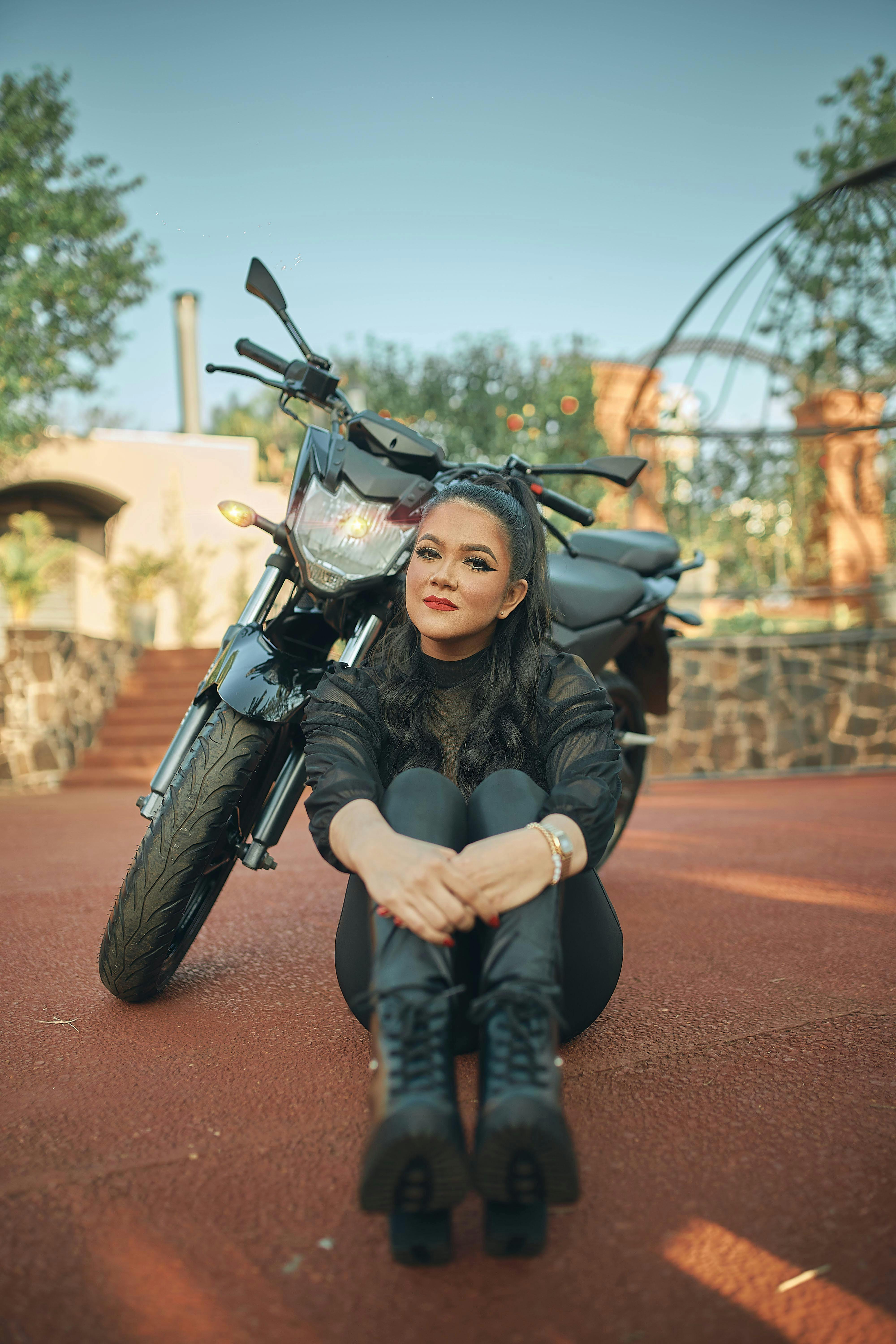 Young Woman Sitting on a Motorcycle. Beautiful Girl Poses on a Motorcycle  Editorial Stock Photo - Image of person, motorbike: 150098973