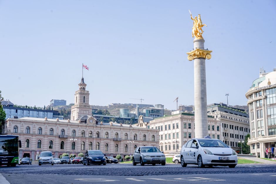 A walking tour group gathered at Freedom Square in Tbilisi, Georgia
