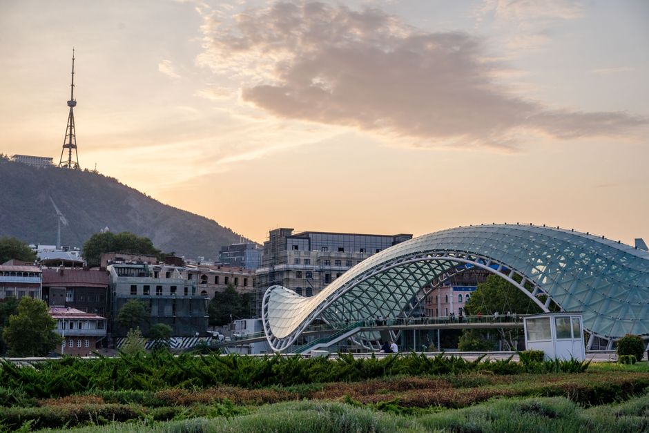 Panoramic view of Tbilisi, Georgia, at sunset, showcasing modern infrastructure and connectivity