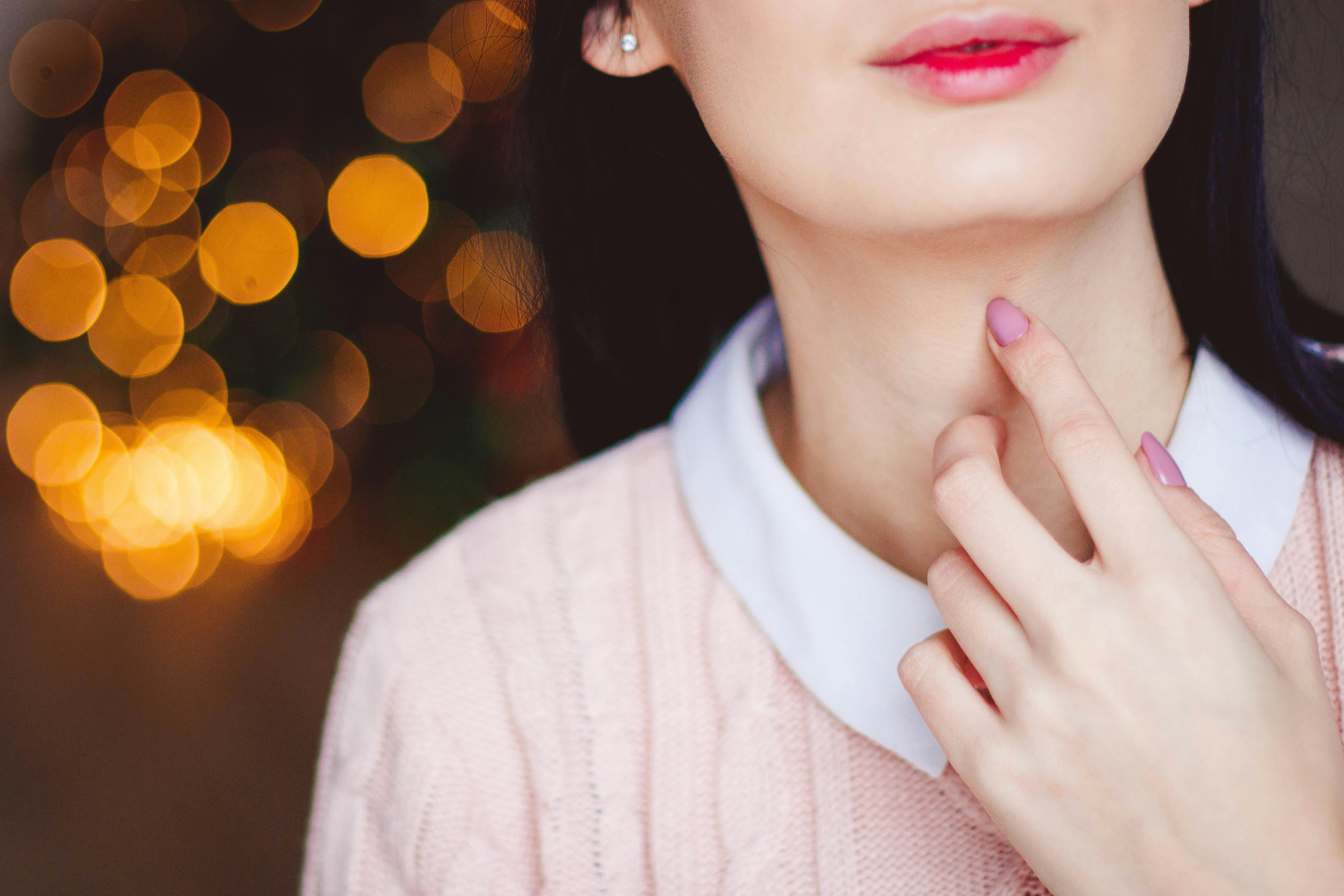 Woman Touching Neck · Free Stock Photo