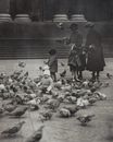 Grayscale Photo of People Standing near Pigeons on Ground