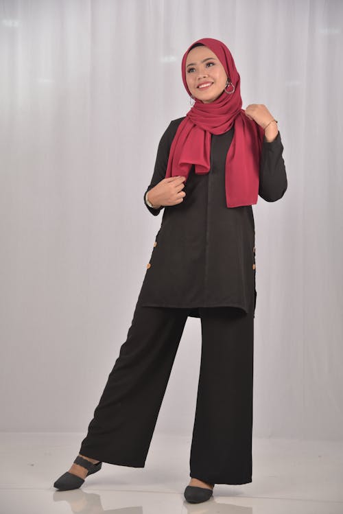 Woman Wearing Black Clothing and Red Hijab