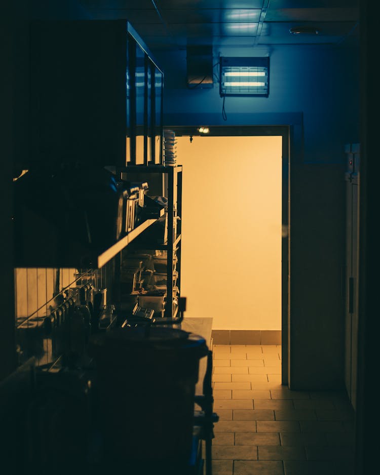 Dark Room With Light Coming Through The Door 