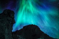 Black Rock Formation Under Green Sky