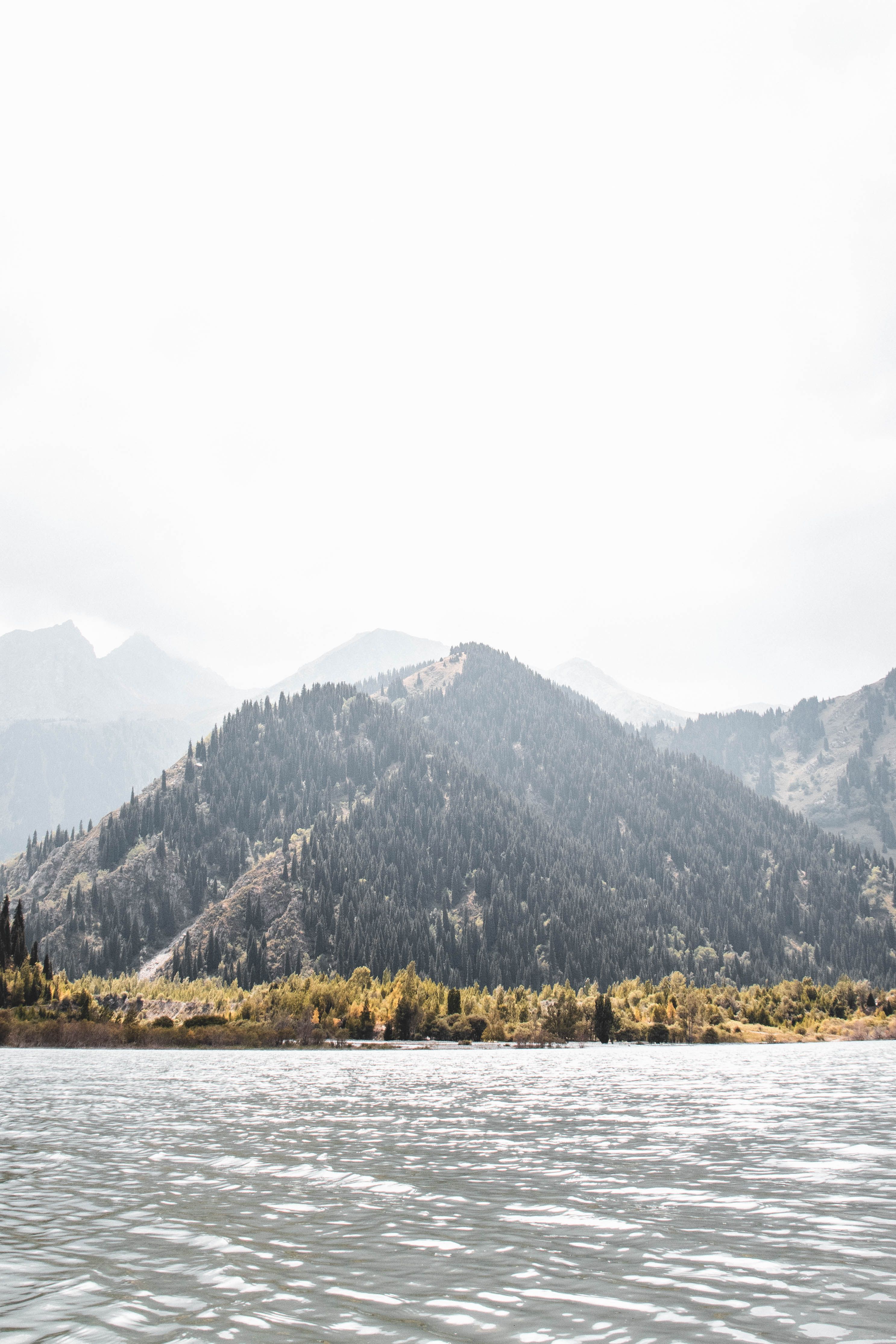 Beautiful mountain view with a tranquil lake in Almaty, capturing nature's serenity.