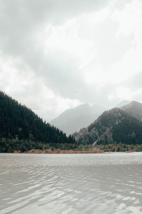 Free Idyllic view of mountains and lake in Almaty, Kazakhstan, showcasing serene nature. Stock Photo