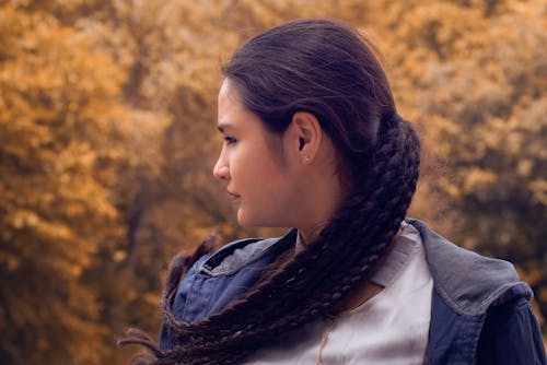 Free Side View of a Woman with Braided Hair Stock Photo