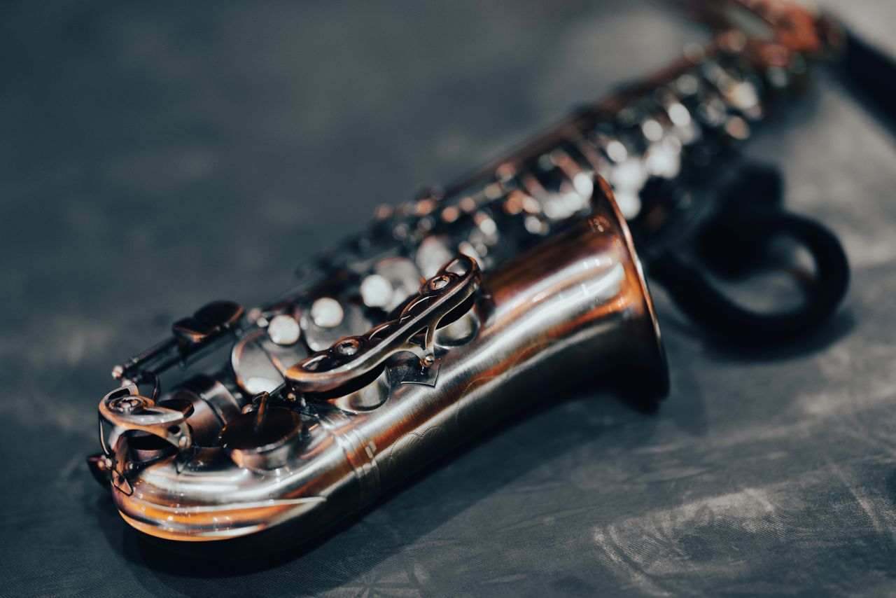 detailed shot of a saxophone showcasing its shiny brass body against a