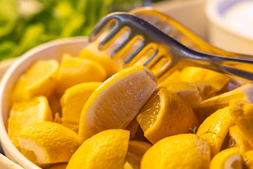 Free Sliced Orange Fruit on White Ceramic Bowl Stock Photo