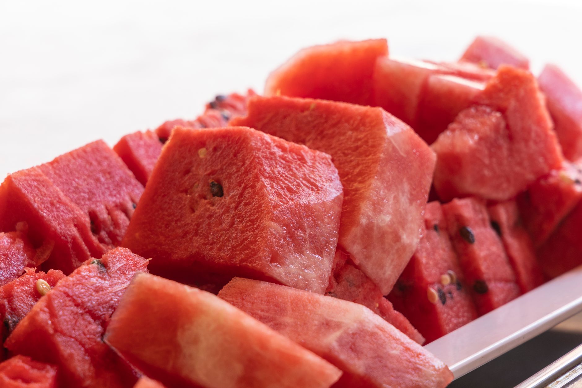 Cut watermelon slices arranged for serving, used here to illustrate whole-fruit intake rather than a supplement claim.