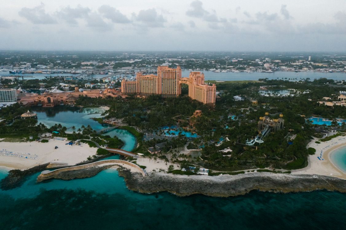Aerial View of a Resort Surrounded by Trees and Water · Free Stock Photo