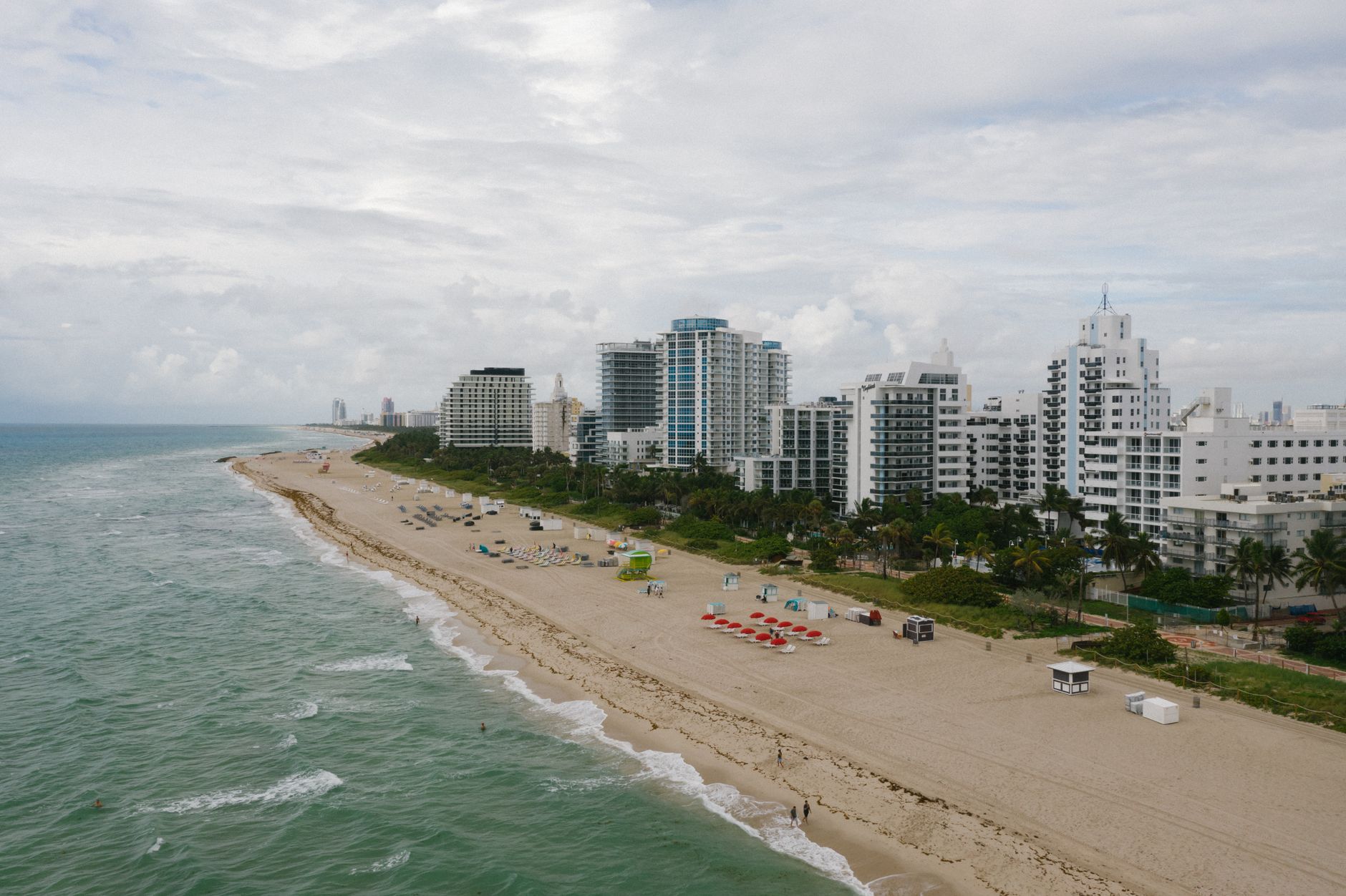 Explore the beautiful Miami Beach coastline with high-rise buildings in this stunning aerial photo.