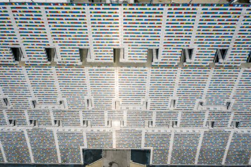 Free Aerial view of a colorful empty stadium seating area, showcasing a pattern of seats. Stock Photo