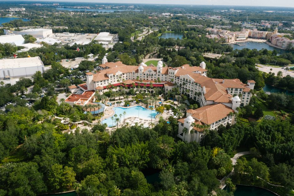 Outstanding Private Helicopter 77 Miles Fireworks Tour over all Theme Parks Review 2026 - Aerial view of a luxury hotel surrounded by lush greenery and a large pool in Orlando.