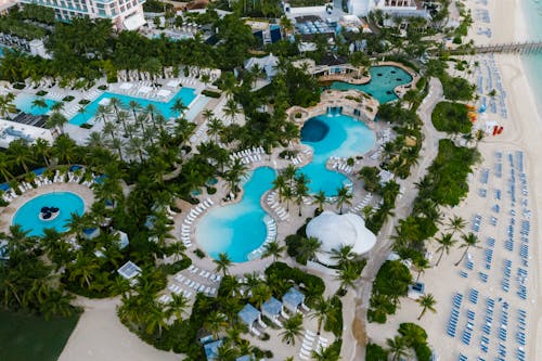 Free Birds Eye View of Swimming Pools at a Beachfront Resort Stock Photo