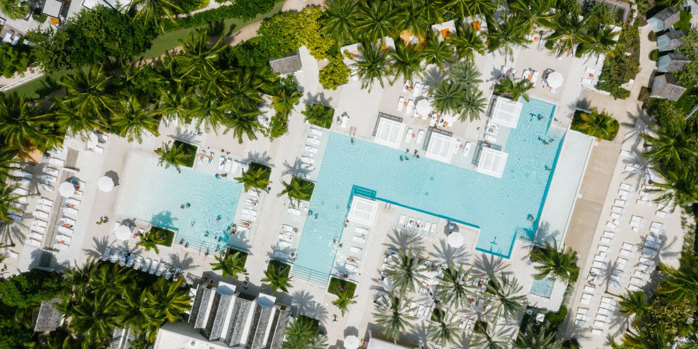 Resort swimming pool and loungers at a luxury hotel