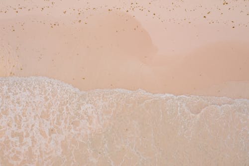 Free Ocean Waves on Brown Sand Stock Photo