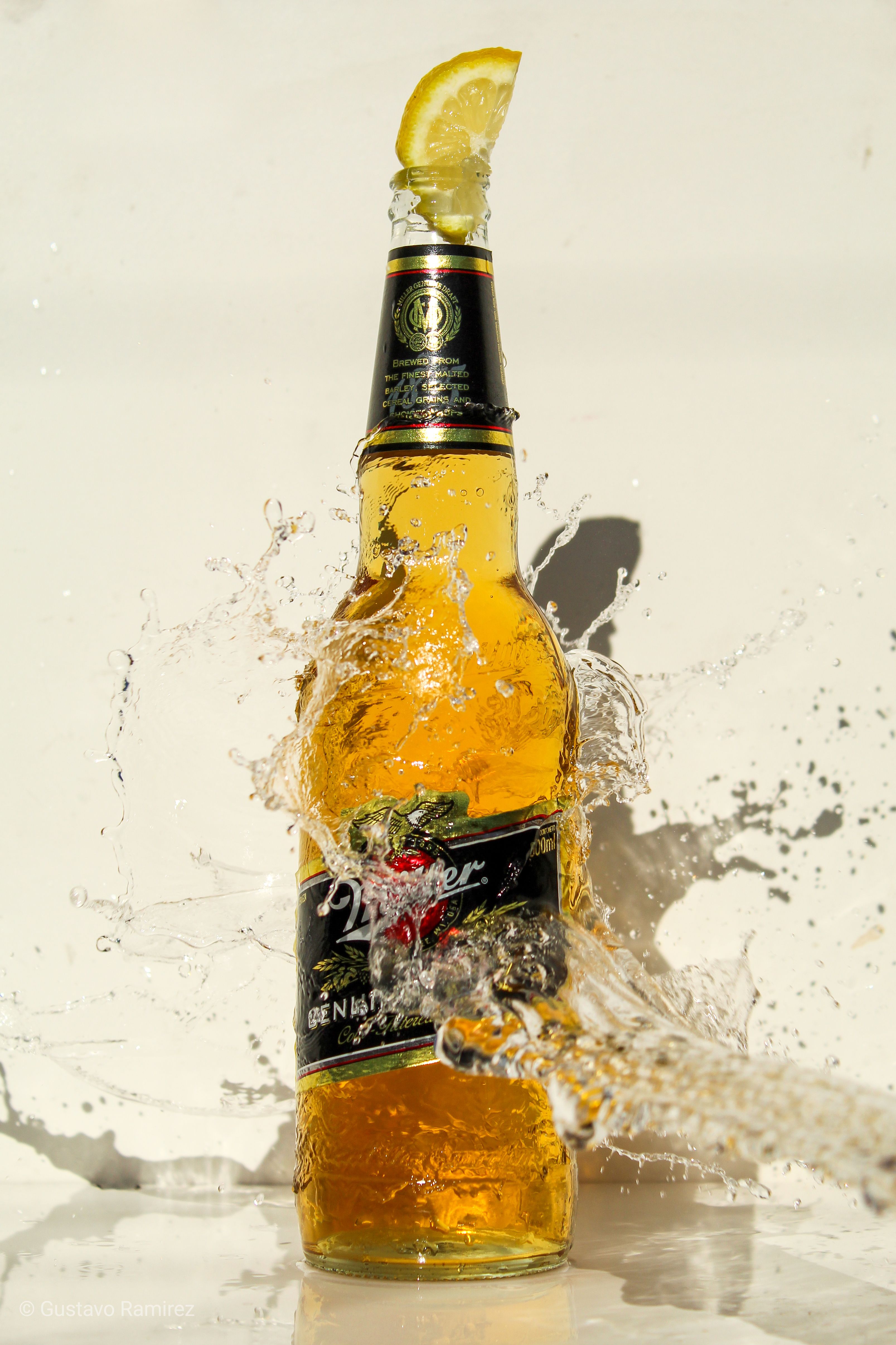 Splash of Water on Alcoholic Bottle · Free Stock Photo