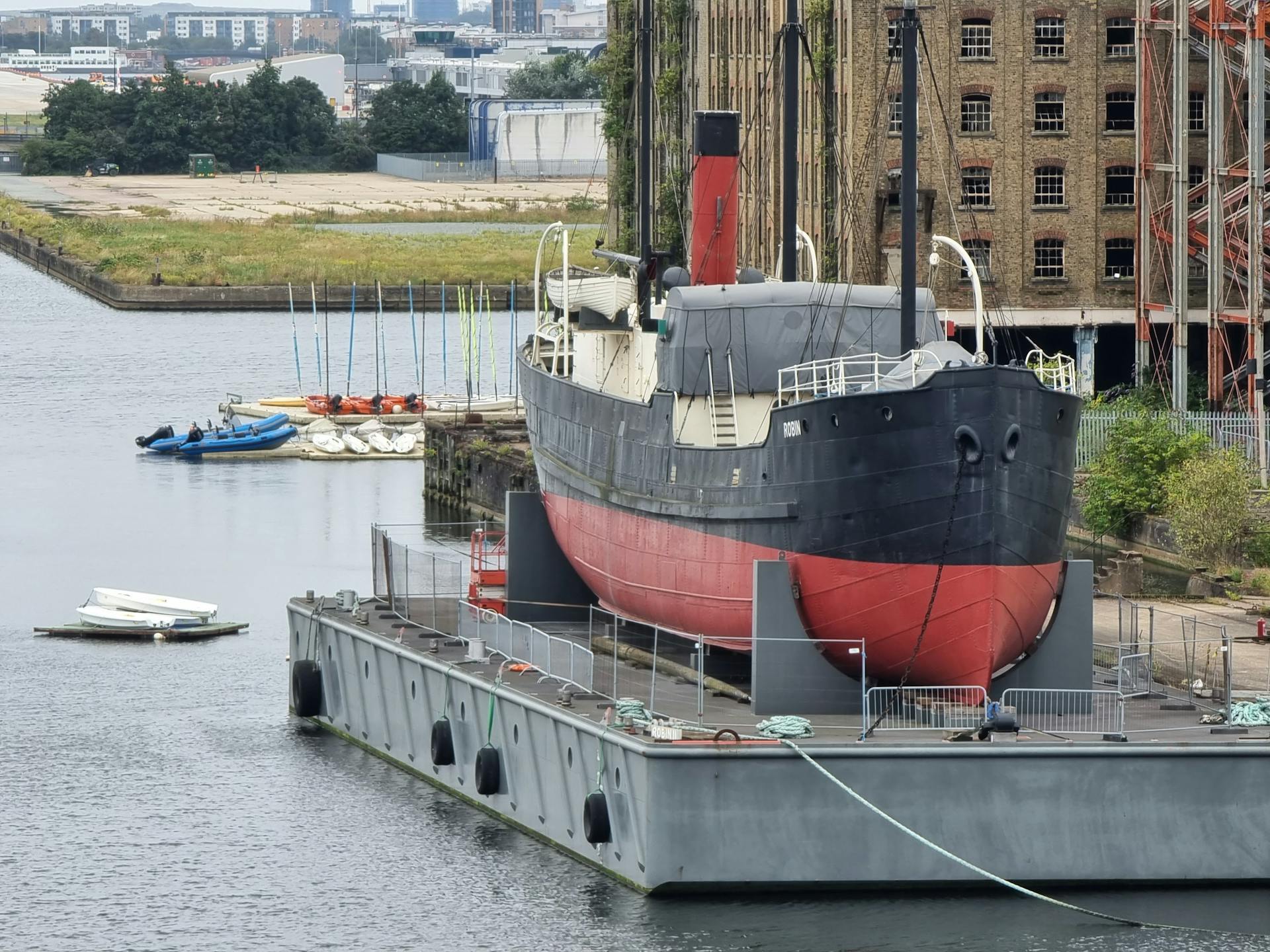SS Robin, a historic steamship, docked in London's Royal Victoria Dock, showcasing maritime heritage.